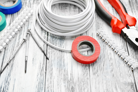 Different electrical tools on wooden table