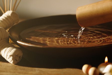 Beautiful spa composition with pouring waterの写真素材