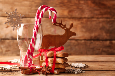 Christmas decoration with candy canes on wooden backgroundの写真素材