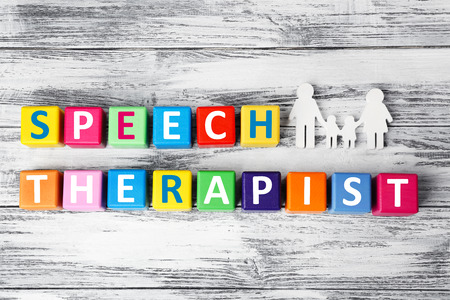 Colourful cubes with text SPEECH THERAPIST on wooden backgroundの写真素材