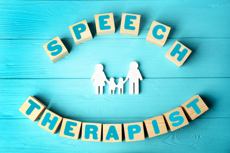 Cubes with text SPEECH THERAPIST on blue wooden backgroundの写真素材