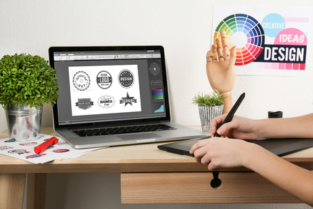 Young designer drawing sketches on graphic tabletの写真素材