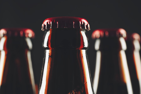 Bottles of beer on black background, closeupの写真素材