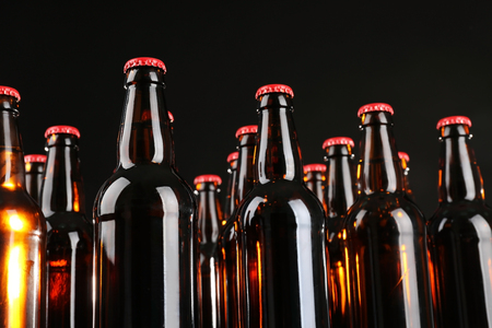 Bottles of beer on black background, closeupの写真素材