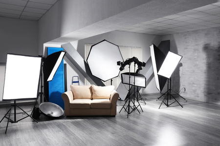 Photo studio with modern interior and lighting equipmentの写真素材