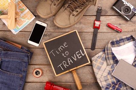 Travel accessories on wooden backgroundの写真素材