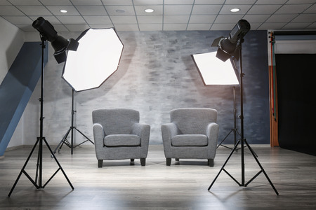 Photo studio with modern interior and lighting equipmentの写真素材