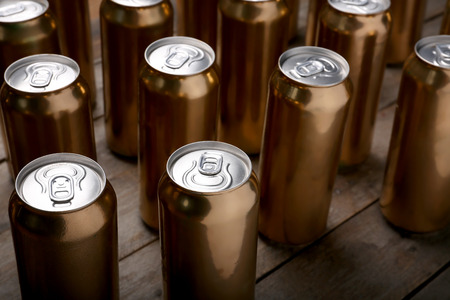 Cans of beer on wooden backgroundの写真素材