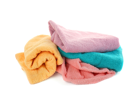 Pile of towels isolated on whiteの写真素材