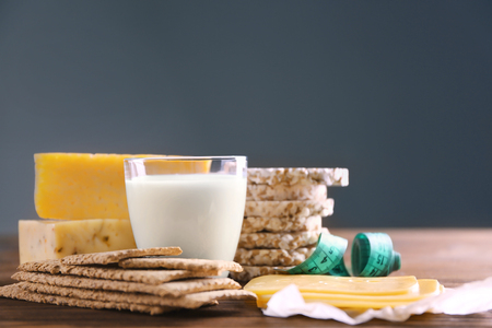 Different dairy products on wooden backgroundの写真素材