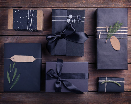 Crafted Christmas gifts on wooden background