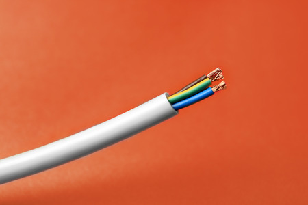 Cable on color background, closeup