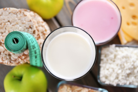Different dairy products on wooden backgroundの写真素材