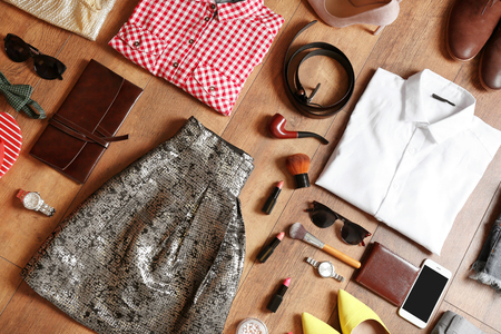 Flat lay set of female clothes and accessories on wooden backgroundの写真素材