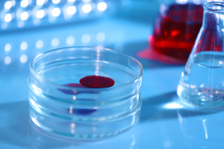 Chemical glassware with blood on blurred backgroundの写真素材