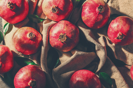 Whole pomegranates on napkin
