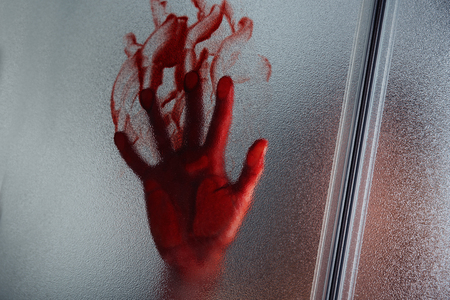 Bloody hand of depressed woman in showerの写真素材