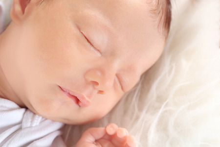 Cute little baby sleeping at home, closeupの写真素材