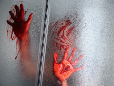 Bloody hands of depressed woman in shower