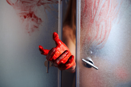 Bloody hand of depressed woman in showerの写真素材