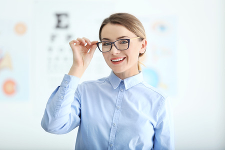 Woman with eyeglasses on blurred background