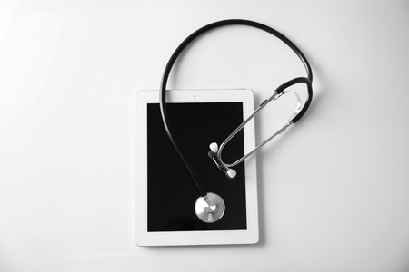 Stethoscope and tablet pc on white backgroundの写真素材