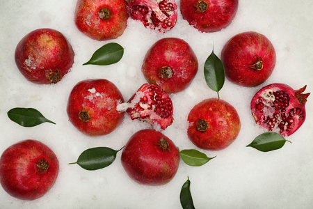 Pomegranates on snow backgroundの写真素材