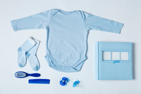 Baby clothes and accessories on white backgroundの写真素材