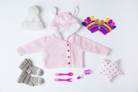 Baby clothes and accessories on white backgroundの写真素材