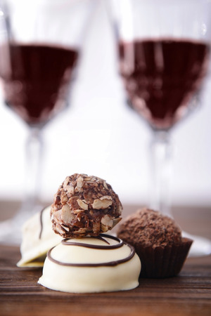 Delicious chocolates on wooden table closeupの写真素材