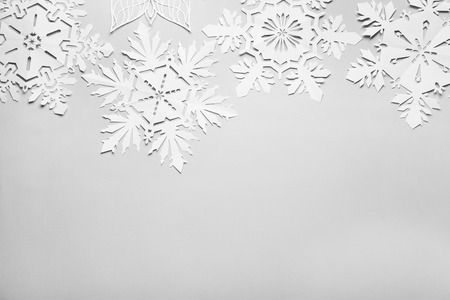 Beautiful paper snowflakes on light backgroundの写真素材