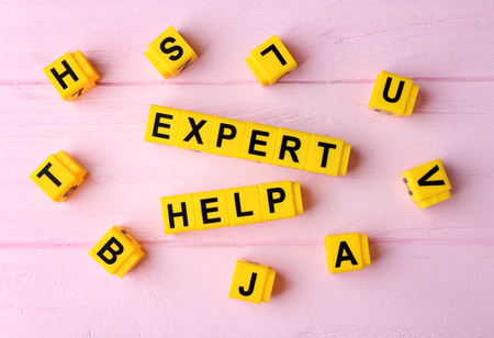 Phrase EXPERT HELP on wooden background
