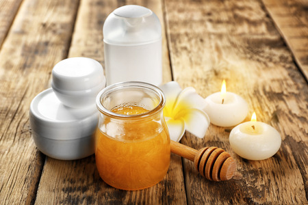 Beautiful honey spa composition on wooden tableの写真素材