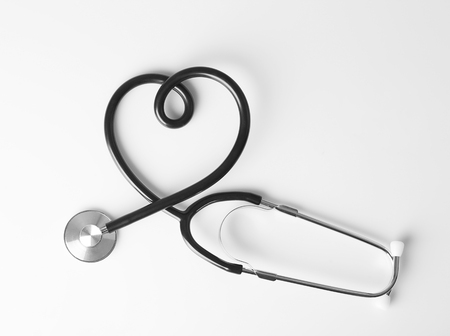 Stethoscope in shape of heart isolated on white. Cardiology conceptの写真素材