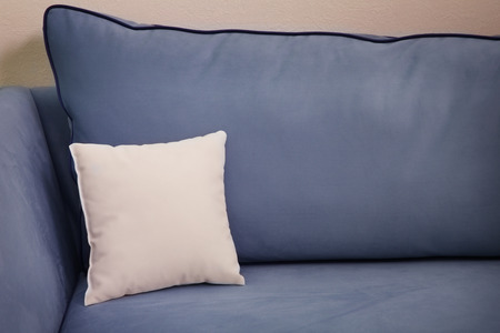 Blank soft pillow on cozy couchの写真素材