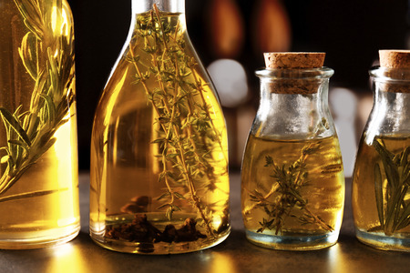 Bottles with oil on table, closeupの写真素材