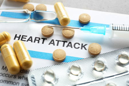 Diagnosis HEART ATTACK on medical report and medicines closeup