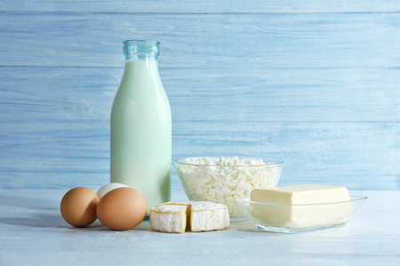 Different dairy products on wooden backgroundの写真素材