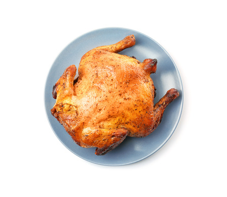 Plate with roasted beer can chicken on white backgroundの写真素材