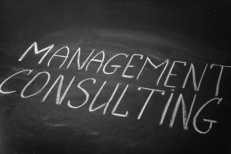 Phrase MANAGEMENT CONSULTING written on blackboardの写真素材