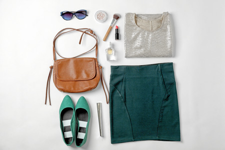 Set of stylish clothes and cosmetics for woman on white backgroundの写真素材
