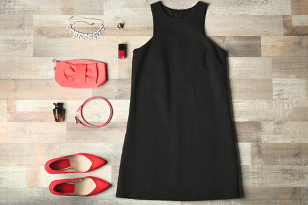 Stylish female clothes with accessories on wooden backgroundの写真素材