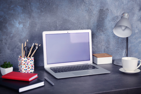 Comfortable workplace with modern laptopの写真素材