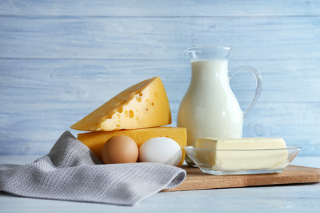 Different dairy products on wooden backgroundの写真素材