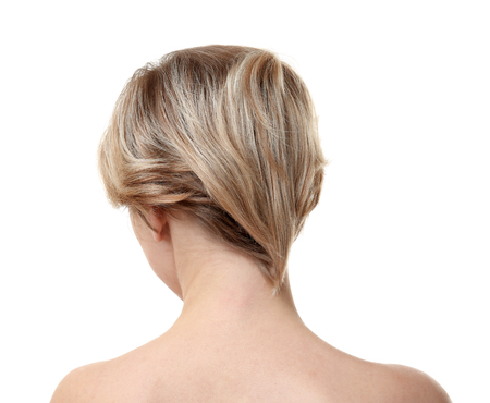 Young woman with trendy hairstyle on white backgroundの写真素材