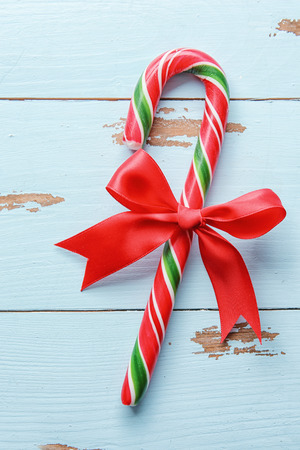 Christmas candy cane on wooden backgroundの写真素材