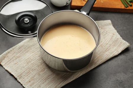 Saucepan with beer cheese dip on napkinの写真素材
