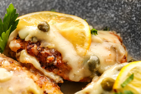 Delicious Italian chicken piccata with lemon, closeupの写真素材