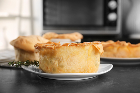 Plate with delicious chicken pot pie on kitchen tableの写真素材
