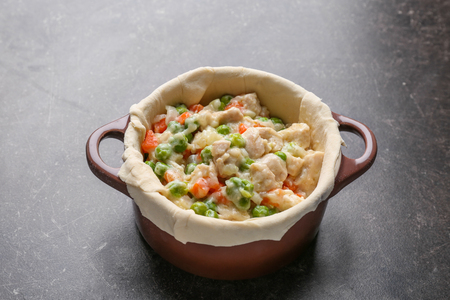 Delicious chicken pot pie on grey tableの写真素材